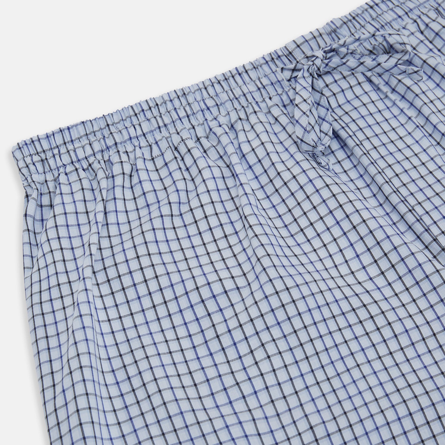 View 2 of product Turnbull & Asser Blue Shadow Check Pyjama Trousers feature cotton fabric, an elastic waistband, and a drawstring, shown flat on a white background.