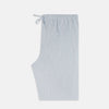 View 4 of product Turnbull & Asser Blue Multi Pinstripe Pyjama Trousers in light blue and white cotton with blue pinstripes, elastic waistband, and drawstring, shown laid flat on a white background.
