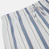 View 2 of product The Turnbull & Asser Blue Blazer Stripe Pyjama Trousers feature blue, white, and light brown vertical stripes and a drawstring waistband, shown laid flat on a white background.