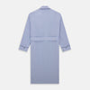 View 4 of product The Blue Fine Bengal Stripe Piped Cotton Gown by Turnbull & Asser features long sleeves, a shawl collar, navy piping, three pockets, and a fabric belt—ideal for those who appreciate classic cotton dressing gowns.