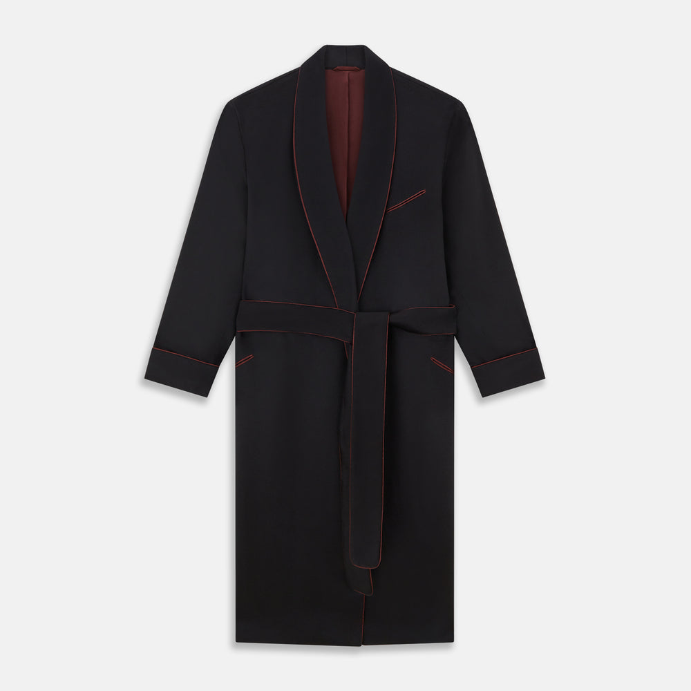 The Navy and Red Piped Cashmere Gown by Turnbull & Asser features a belted navy silhouette with red contrast piping, wide lapels, chest pocket, and two side pockets, shown on a plain white background.