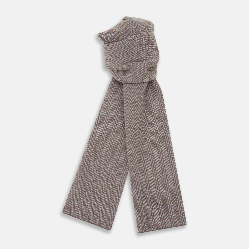 The Turnbull & Asser Reversible Grey Herringbone Cashmere Scarf is artfully folded and displayed on a plain white background.
