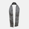 View 1 of product The Chequered Navy on White Frame Small Scarf in Silk by Turnbull & Asser UK is a long silk accessory featuring a classic black and white checkerboard pattern laid flat against a white background. Its ends are finished with a thin, fringed border, while the top edge is accented by diagonal stripes. The double-sided chequered design adds a stylish twist, with touches of navy and subtle hints of white bringing sophisticated detail to this timeless look.