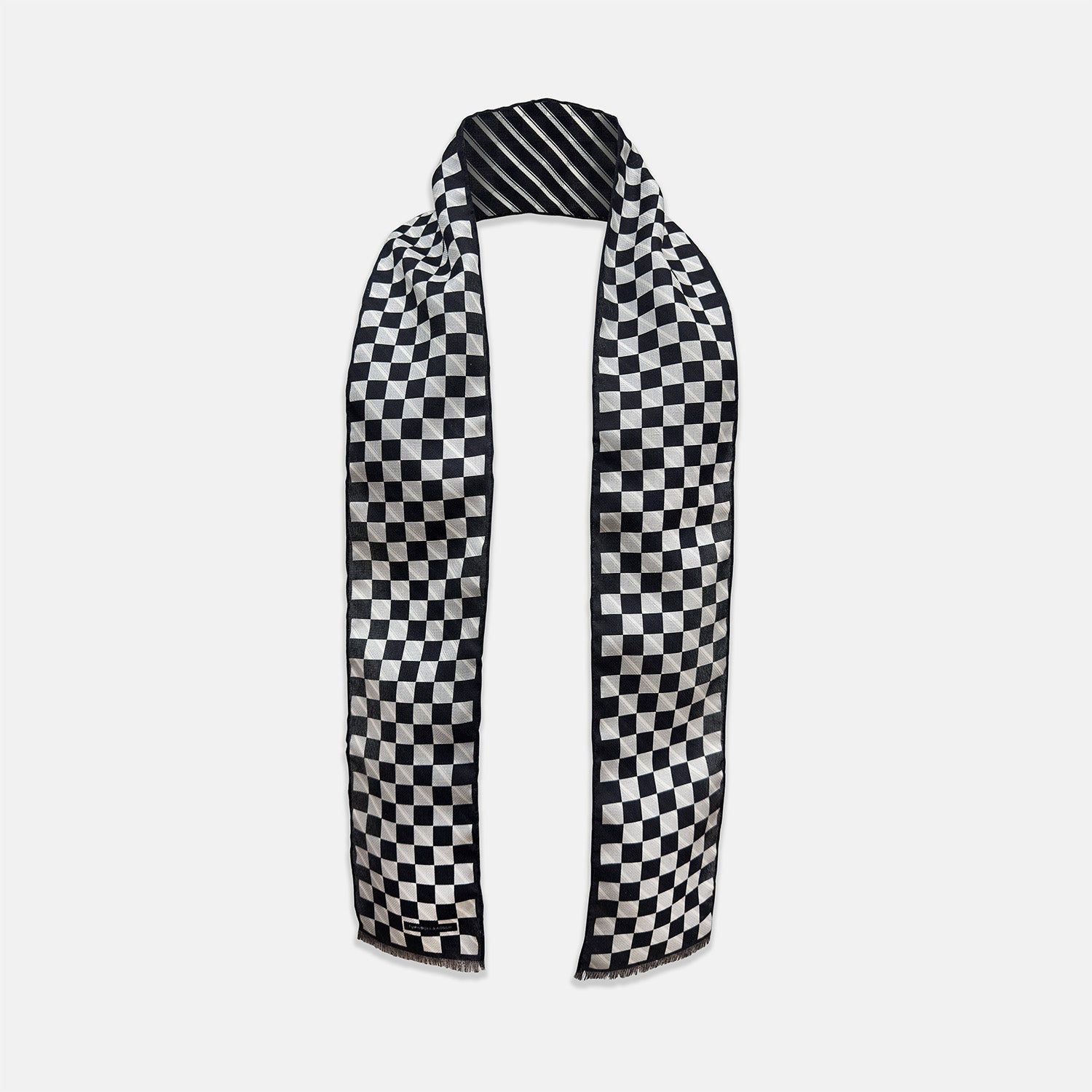 View 1 of product The Chequered Navy on Navy Frame Small Scarf in Silk from Turnbull & Asser UK, showcasing a sophisticated navy checkerboard pattern, is displayed against a plain white background.