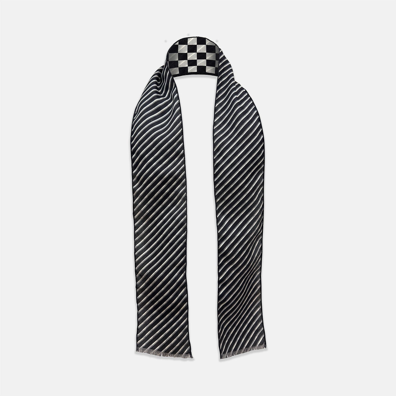 View 2 of product The Chequered Navy on Navy Frame Small Scarf in Silk from Turnbull & Asser UK, showcasing a sophisticated navy checkerboard pattern, is displayed against a plain white background.