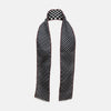 View 2 of product Introducing the Chequered Navy on Red Frame Small Scarf in Silk by Turnbull & Asser UK—a luxurious silk accessory featuring a navy and white chequered pattern, accented with thin red borders and delicate fringe at each end. Displayed against a white background, this scarf pays homage to British motoring heritage and the enduring elegance of Concours style.