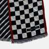View 3 of product Introducing the Chequered Navy on Red Frame Small Scarf in Silk by Turnbull & Asser UK—a luxurious silk accessory featuring a navy and white chequered pattern, accented with thin red borders and delicate fringe at each end. Displayed against a white background, this scarf pays homage to British motoring heritage and the enduring elegance of Concours style.