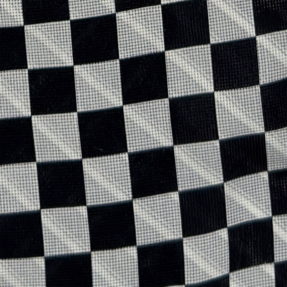 Introducing the Chequered Navy on Red Frame Small Scarf in Silk by Turnbull & Asser UK—a luxurious silk accessory featuring a navy and white chequered pattern, accented with thin red borders and delicate fringe at each end. Displayed against a white background, this scarf pays homage to British motoring heritage and the enduring elegance of Concours style.
