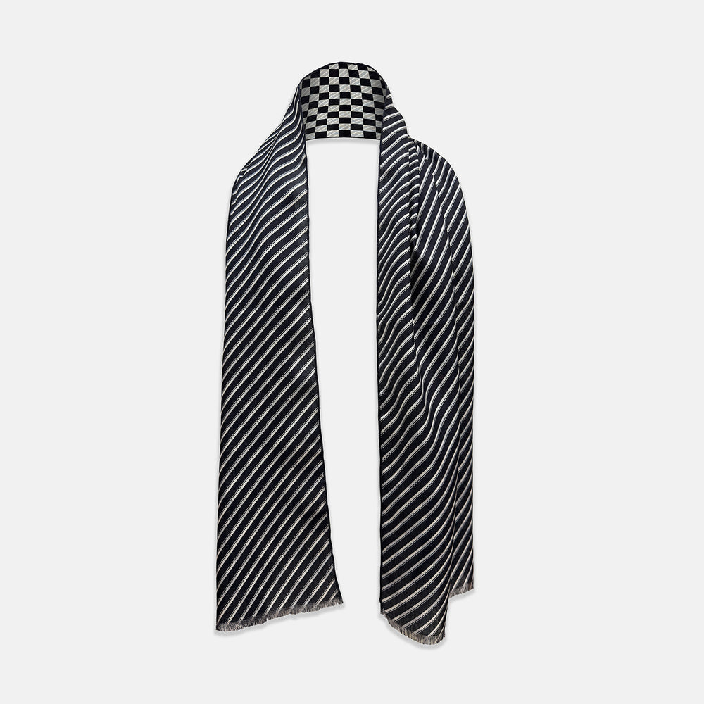 A Chequered Navy on Navy Frame Large Scarf in Silk by Turnbull & Asser UK, featuring a navy checkered design with striped detailing at the neck, is elegantly displayed against a plain white background—an accessory inspired by the enduring sophistication of British motoring, perfect for occasions such as the Concours of Elegance 2026.