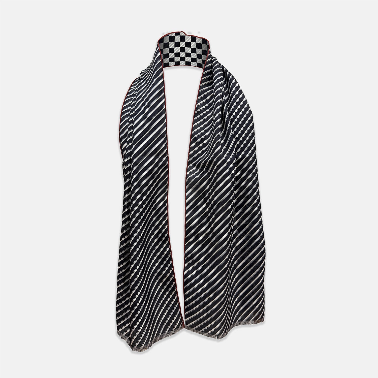 View 2 of product Chequered Navy on Red Frame Large Scarf in Silk by Turnbull & Asser UK, featuring a classic navy and white checkered pattern with a bold red border, elegantly displayed with both ends draped down to reveal the contrasting striped neck detail—a sophisticated nod to British motoring style, perfect for elevating your Concours of Elegance 2026 attire.