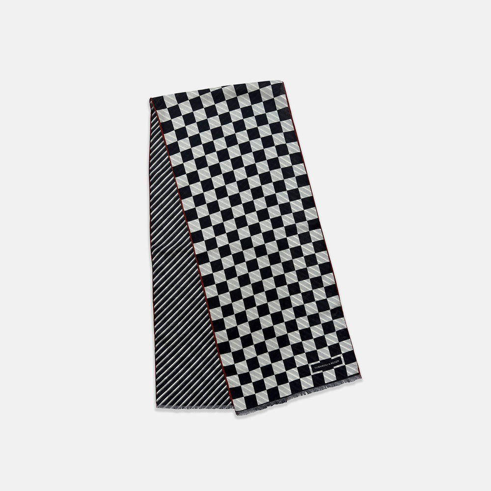 Chequered Navy on Red Frame Large Scarf in Silk by Turnbull & Asser UK, featuring a classic navy and white checkered pattern with a bold red border, elegantly displayed with both ends draped down to reveal the contrasting striped neck detail—a sophisticated nod to British motoring style, perfect for elevating your Concours of Elegance 2026 attire.