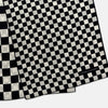 View 4 of product A Chequered Navy & White Scarf in Silk by Turnbull & Asser UK is displayed against a plain white background, showcasing its long, luxurious silk fabric with a striking navy and white checkered pattern.