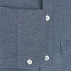 View 3 of product The Turnbull & Asser Steel Blue Piccadilly Shirt features long sleeves, a button-up front, two chest pockets, and white buttons, shown against a plain white background.