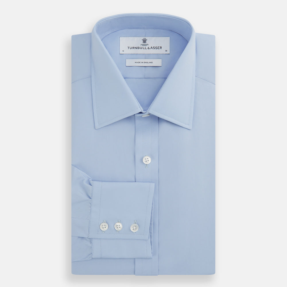 Turnbull & Asser Blue Cotton Shirt with T&A collar and 3-button cuffs, shown laid flat on a white background—perfect for pairing with a navy suit for a sharp look.