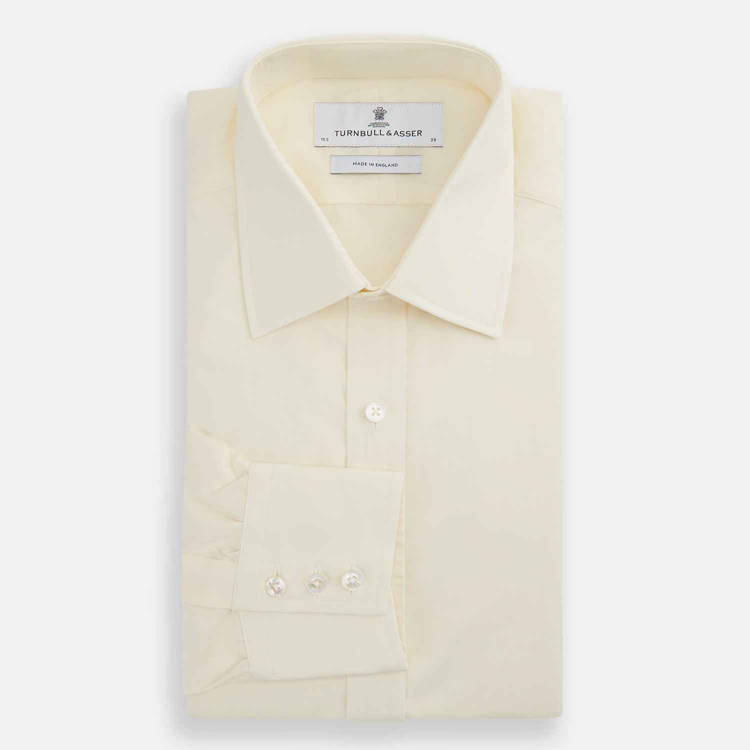 View 5 of product The Turnbull & Asser Cream Cotton Shirt features a T&A collar, button-up front, and 3-button cuffs, displayed on a plain white background.