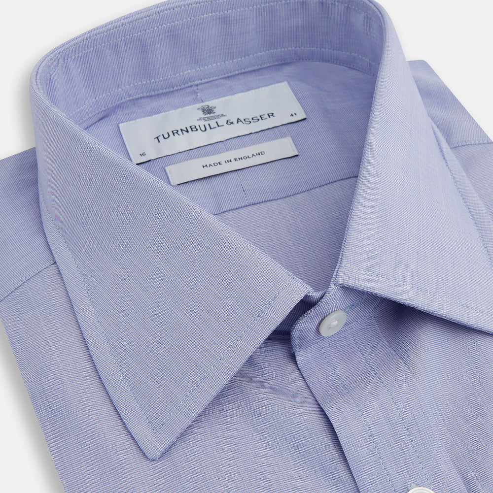 The Turnbull & Asser Blue End-on-End Cotton Shirt features a T&A collar, 3-button cuffs, and white buttons—ideal for pairing with a navy suit or any smart outfit.