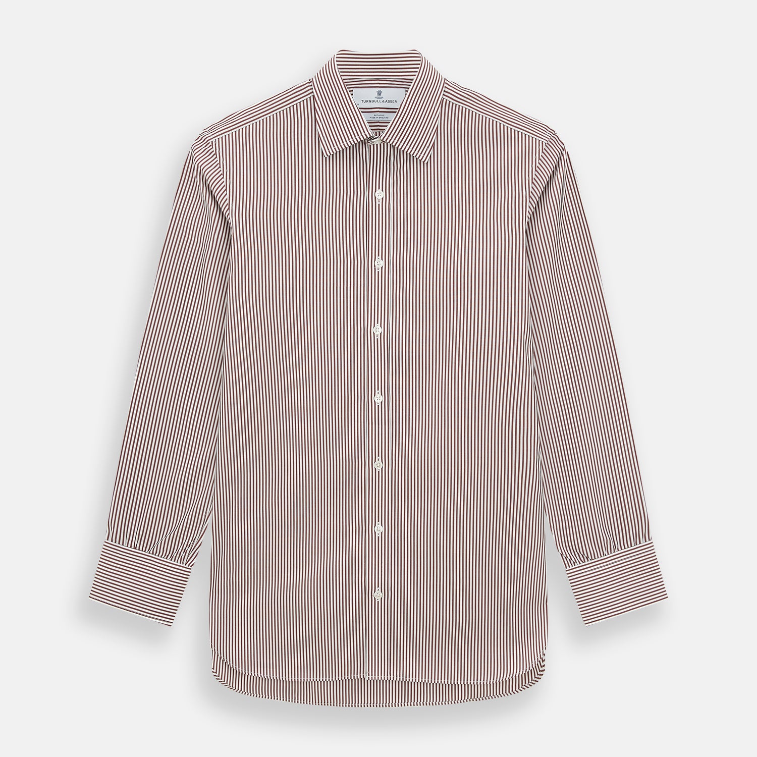 View 1 of product The Turnbull & Asser Burgundy Halo Stripe Winston Shirt features long sleeves, a classic T&A collar, buttoned cuffs, narrow vertical burgundy and white stripes, and is crafted from organic cotton. Displayed on a white background.