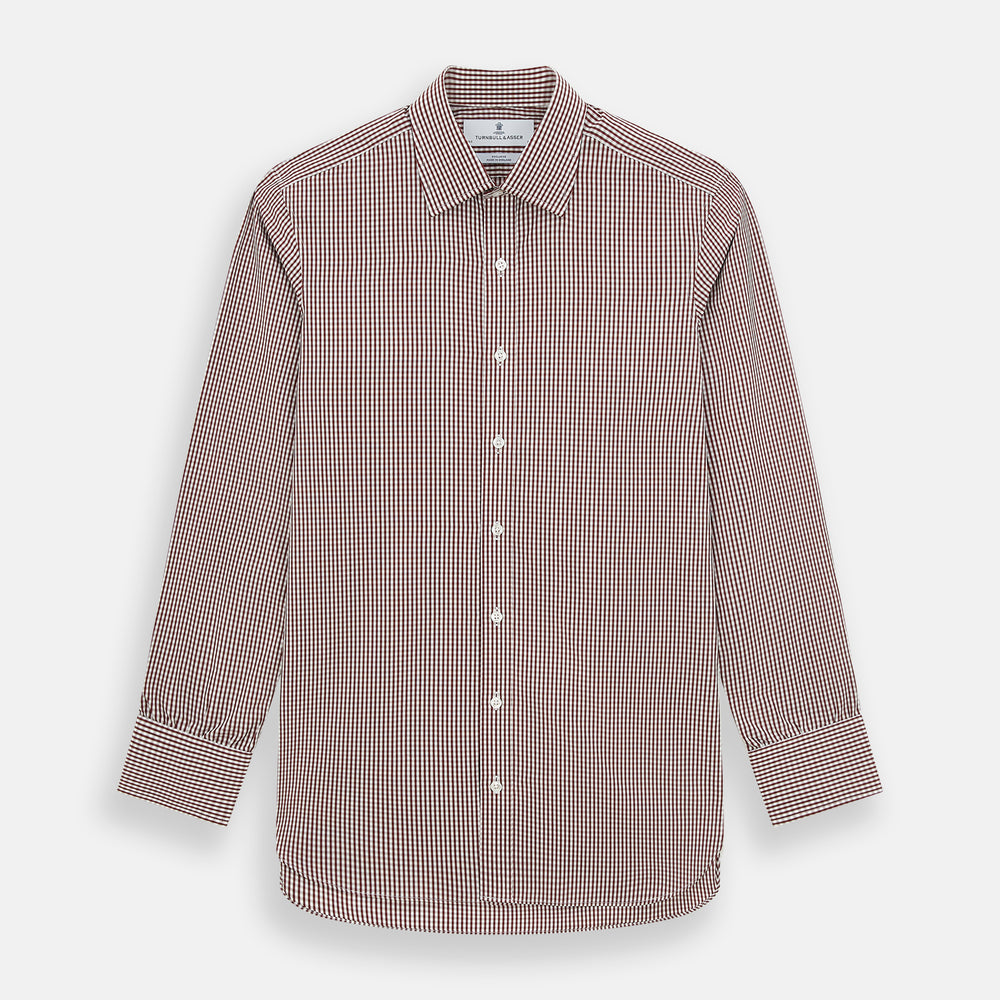 The Turnbull & Asser Burgundy Micro Check Winston Shirt is a long-sleeved, button-up Mayfair fit dress shirt with a collar and buttoned cuffs, featuring a small red and white check pattern and shown on a white background.
