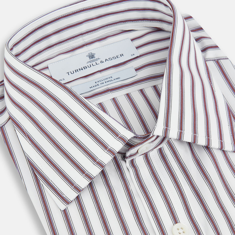 The Turnbull & Asser Burgundy Track Stripe Winston Shirt features long sleeves, classic collar, buttoned cuffs, and vertical white and dark maroon stripes—perfect for formal wear and shown laid flat against a white background.