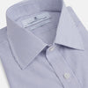 View 2 of product The Turnbull & Asser Blue Pinstripe Mayfair Shirt is a cotton poplin, long-sleeve button-down with a classic collar and white buttons, shown laid flat on a white background.