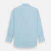 View 5 of product The Turnbull & Asser Blue Cotton Cashmere Mayfair Shirt features long sleeves, a classic collar, buttoned cuffs, and white buttons, shown against a white background.