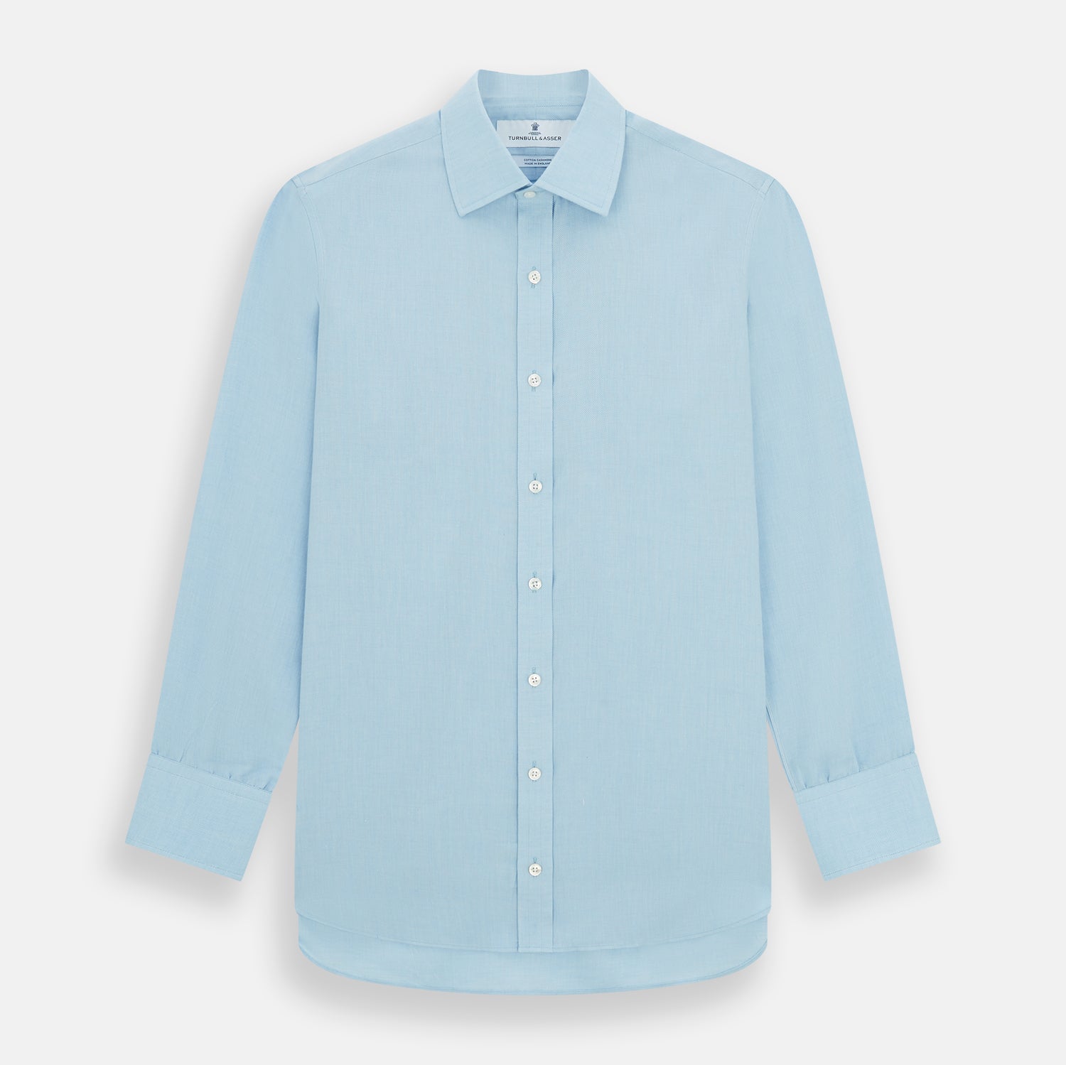 View 1 of product The Turnbull & Asser Blue Cotton Cashmere Mayfair Shirt features long sleeves, a classic collar, buttoned cuffs, and white buttons, shown against a white background.