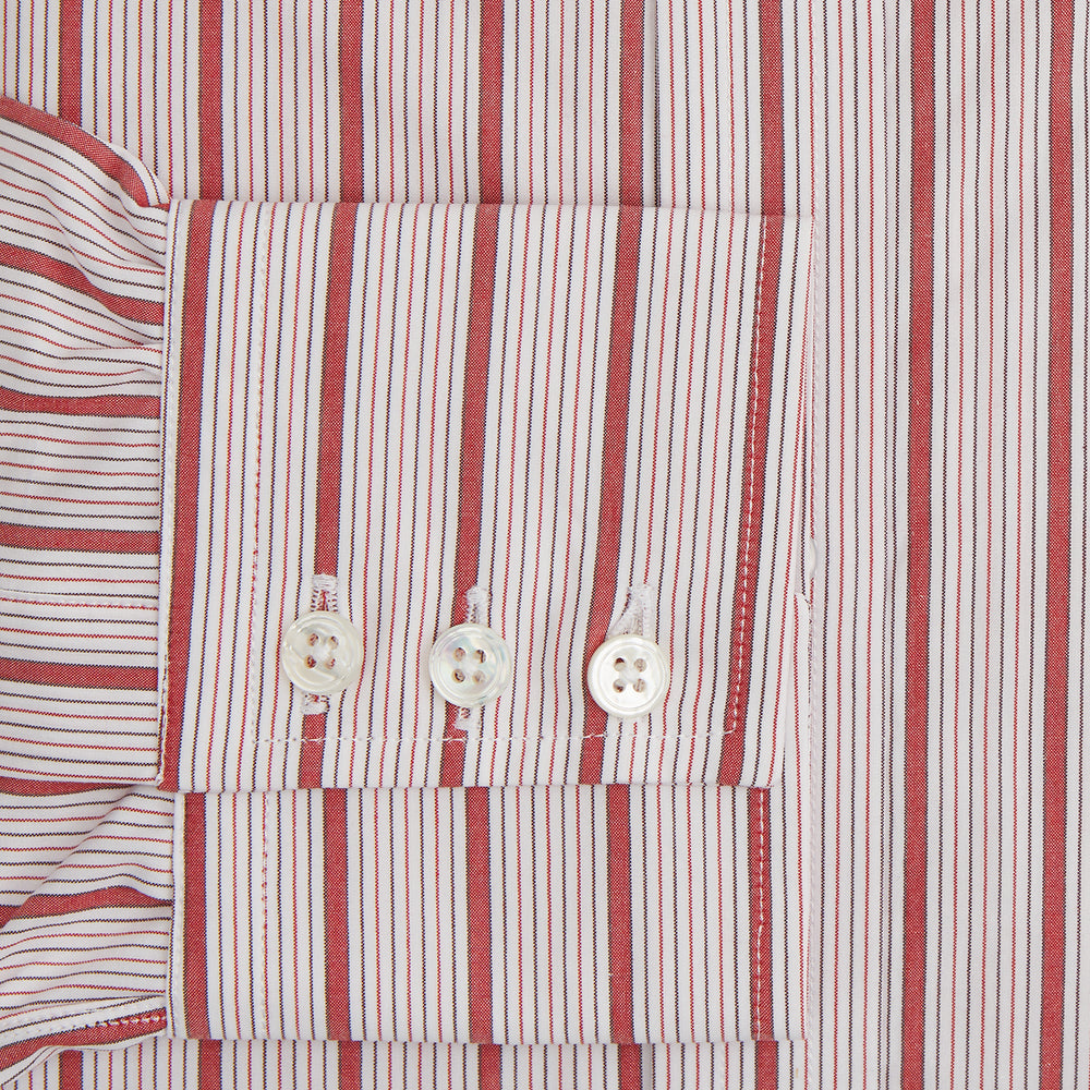 The Red Multi Track Stripe Mayfair Shirt by Turnbull & Asser is a long-sleeved, collared button-up featuring vertical red stripes on white and horizontal red stripes on the cuffs.