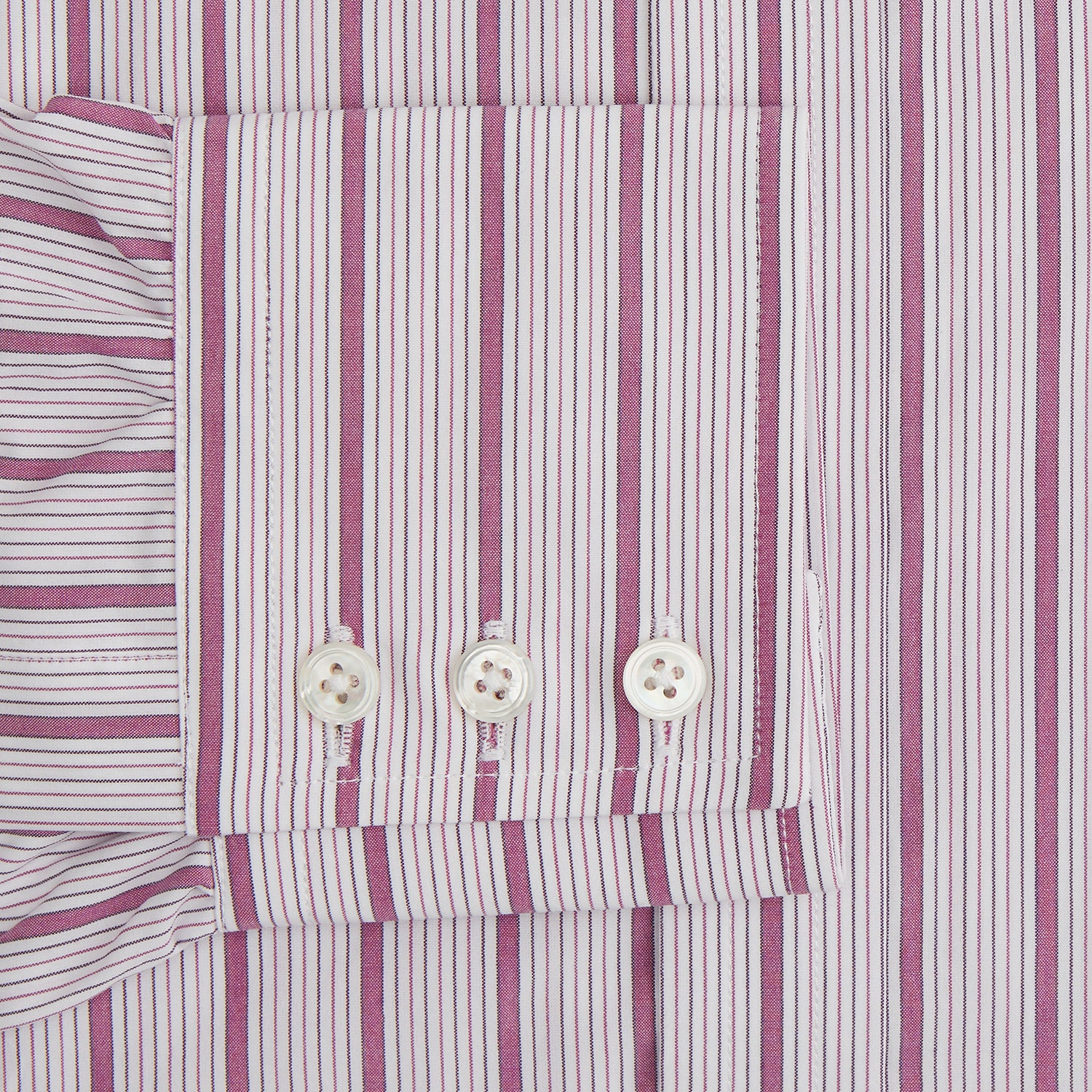 View 3 of product A long-sleeved, collared Turnbull & Asser Purple Multi Track Stripe Mayfair Shirt with buttons, showcasing vertical purple multi-colored stripes, neatly displayed against a plain background.