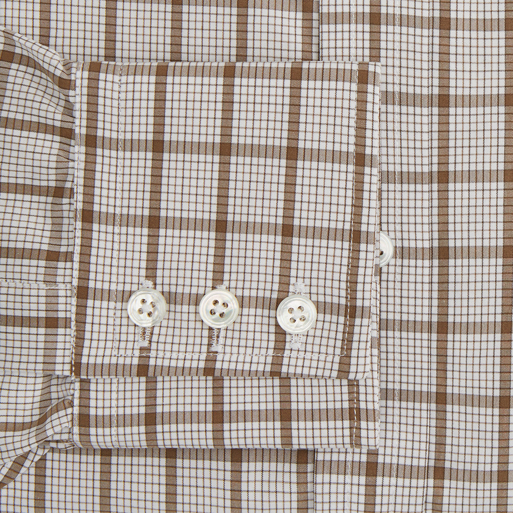 The Turnbull & Asser Brown Graph Overlay Check Mayfair Shirt, an organic cotton long-sleeve button-up with collar and cuffed sleeves, features a beige and white check pattern and is shown laid flat on a white background.