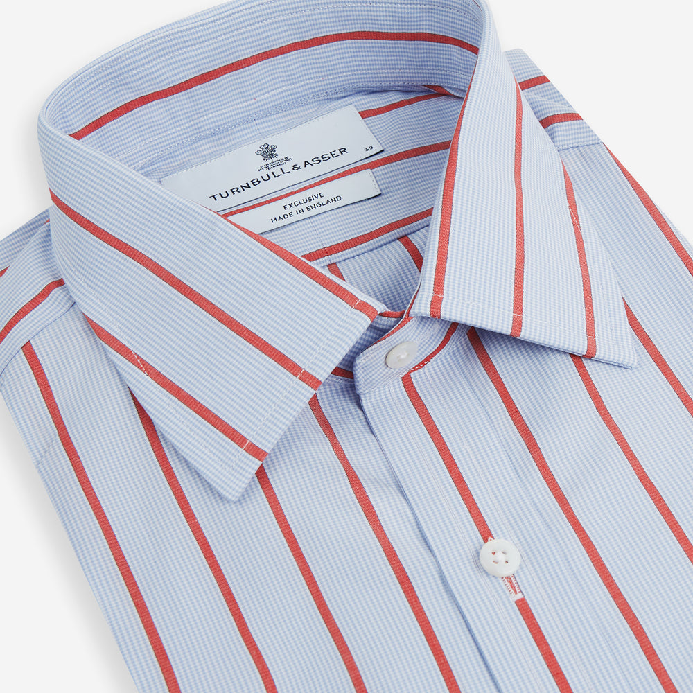 The Red Track Stripe Mayfair Shirt by Turnbull & Asser is made from organic cotton, features a T&A collar, and displays red vertical stripes on light blue, shown against a plain white background.