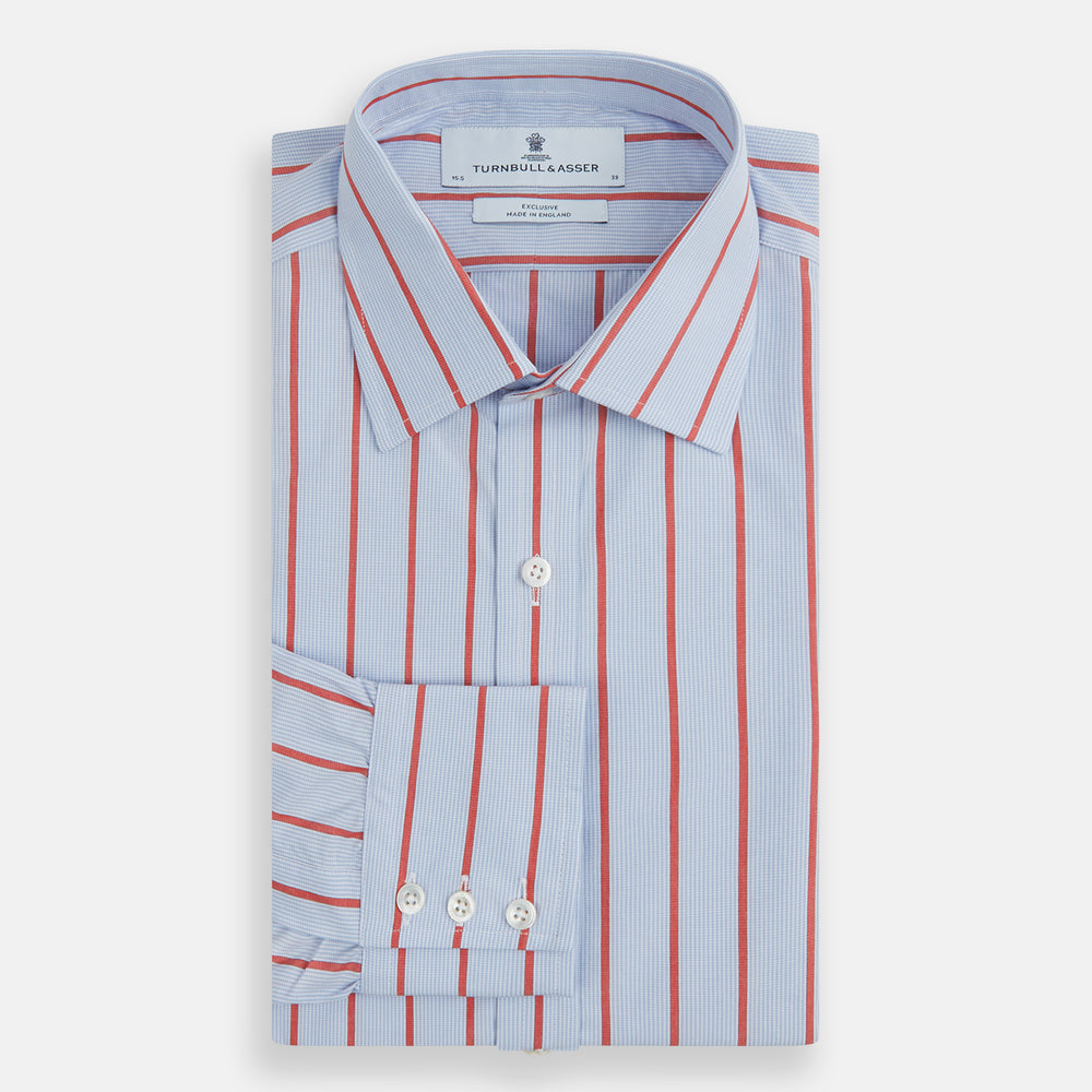 The Red Track Stripe Mayfair Shirt by Turnbull & Asser is made from organic cotton, features a T&A collar, and displays red vertical stripes on light blue, shown against a plain white background.