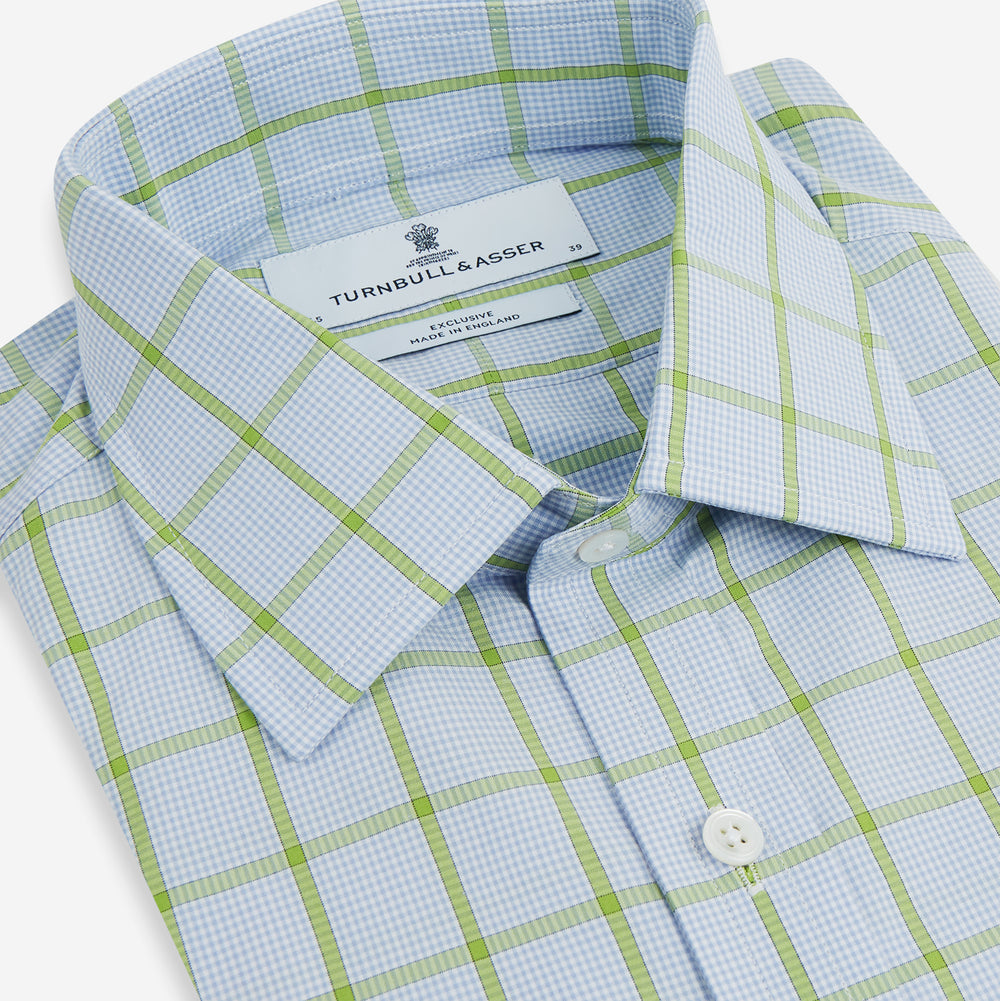 The Turnbull & Asser Light Green Windowpane Check Mayfair Shirt, crafted from organic cotton with a classic collar and buttoned cuffs, is displayed on a plain white background.