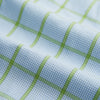View 5 of product The Turnbull & Asser Light Green Windowpane Check Mayfair Shirt, crafted from organic cotton with a classic collar and buttoned cuffs, is displayed on a plain white background.
