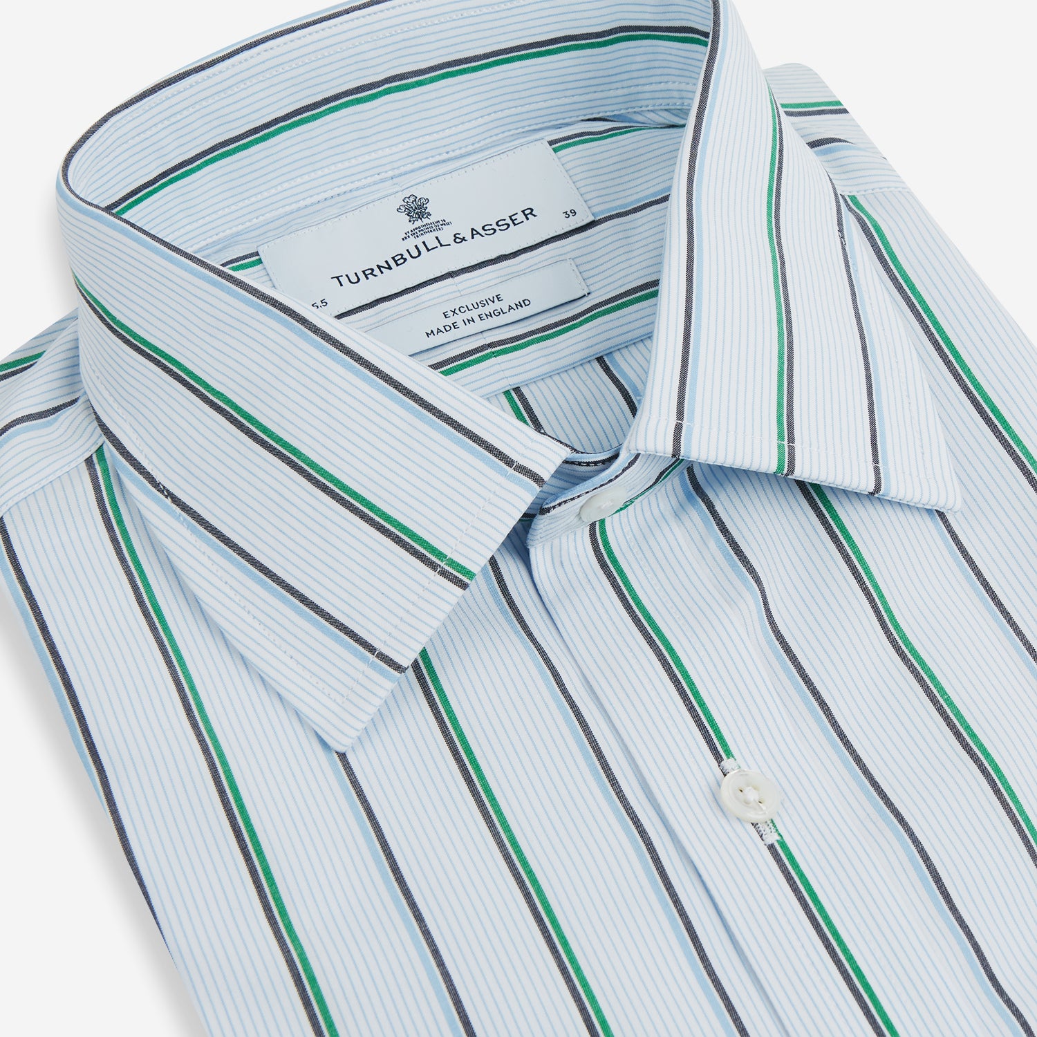 View 2 of product The Blue and Green Shadow Stripe Mayfair Shirt by Turnbull & Asser is a long-sleeved, organic cotton button-up with a T&A collar, buttoned cuffs, and blue and green vertical stripes on white. Features a slightly rounded hem.