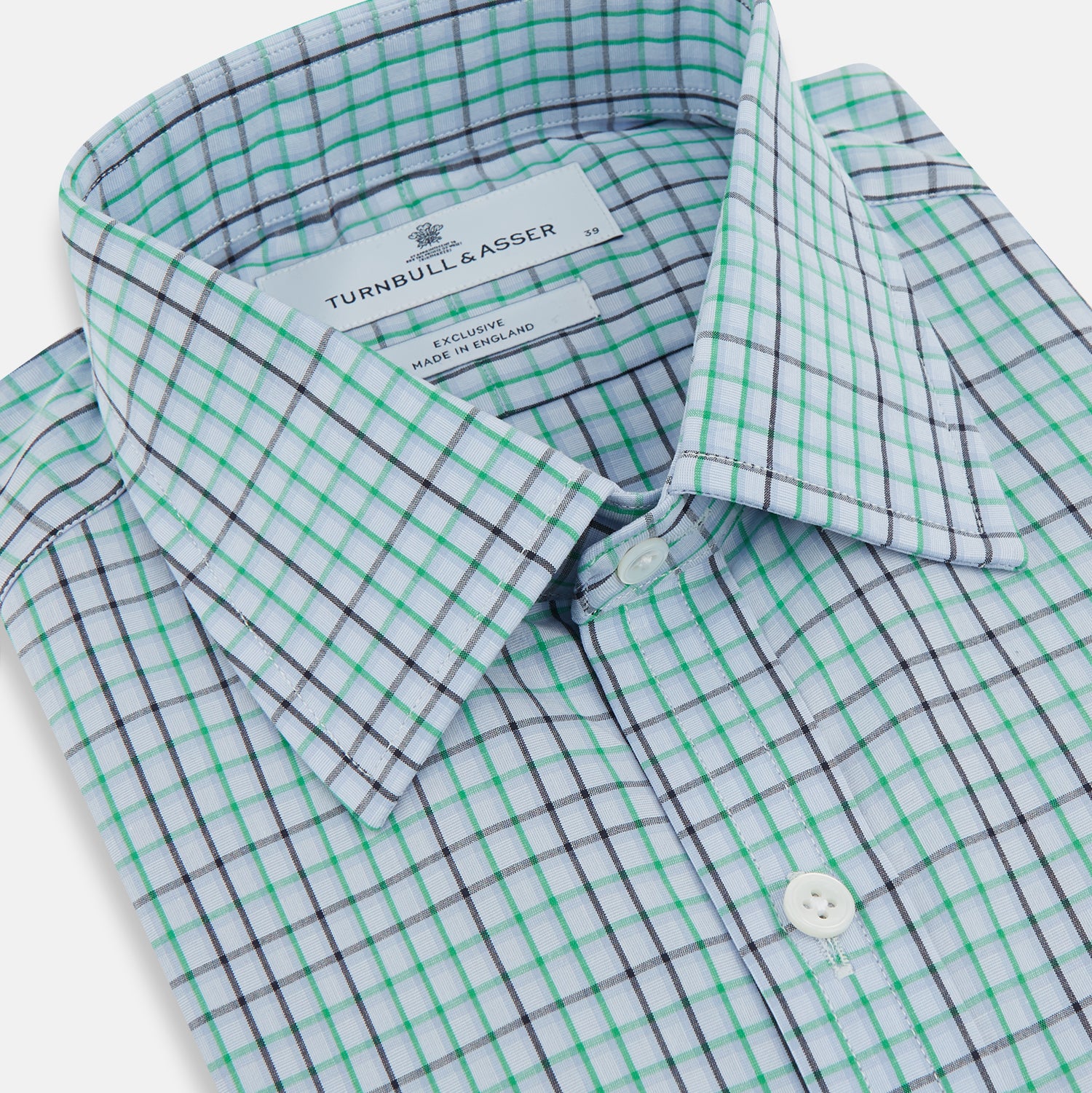 View 2 of product The Turnbull & Asser Green and Blue Shadow Check Mayfair Shirt is a long-sleeve button-down with a T&A collar, made from organic cotton in a blue, green, and white plaid pattern, shown on a white background.