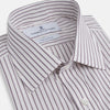 View 2 of product The Turnbull & Asser Purple Track Stripe Mayfair Shirt is a long-sleeve, button-up organic cotton shirt with a T&A collar, showcasing thin vertical black stripes on white and laid flat on a white surface.