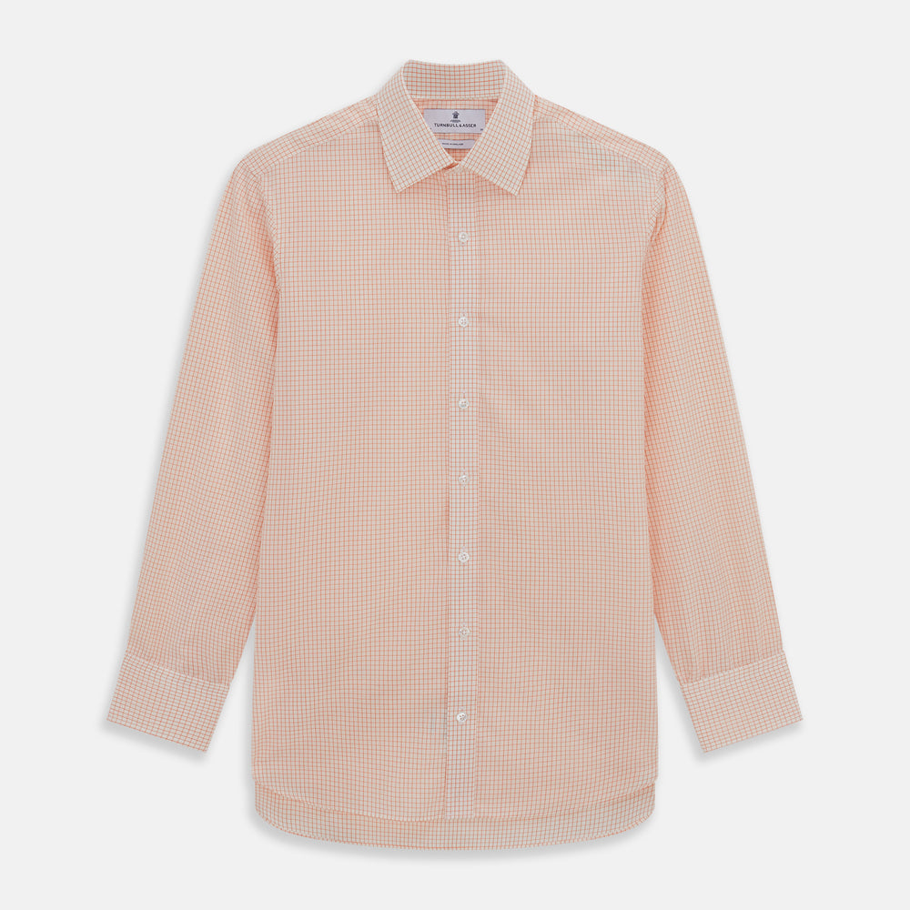 The Turnbull & Asser Orange Graph Check Mayfair Shirt features a classic T&A collar, long sleeves, buttoned cuffs, and a peach and white check pattern, shown against a white background.