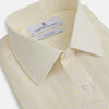 View 2 of product The Turnbull & Asser Yellow Pinstripe Mayfair Shirt, made from organic cotton with long sleeves, a T&A collar, and front buttons, features subtle vertical stripes and is shown on a plain white background.