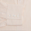 View 3 of product The Turnbull & Asser Orange Pinstripe Mayfair Shirt with a T&A collar and thin peach and white stripes is laid flat on a white background.