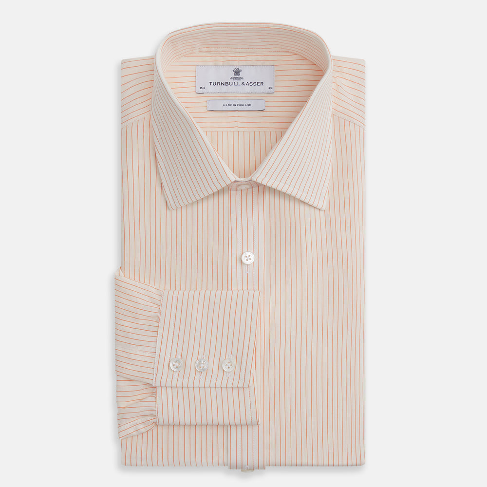 The Turnbull & Asser Orange Pinstripe Mayfair Shirt with a T&A collar and thin peach and white stripes is laid flat on a white background.