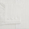 View 3 of product The Turnbull & Asser Pale Blue Fine Track Stripe Mayfair Shirt is a long-sleeve, cream-colored organic cotton shirt with subtle pale blue stripes, a T&A collar, and buttoned cuffs, shown on a plain white background.