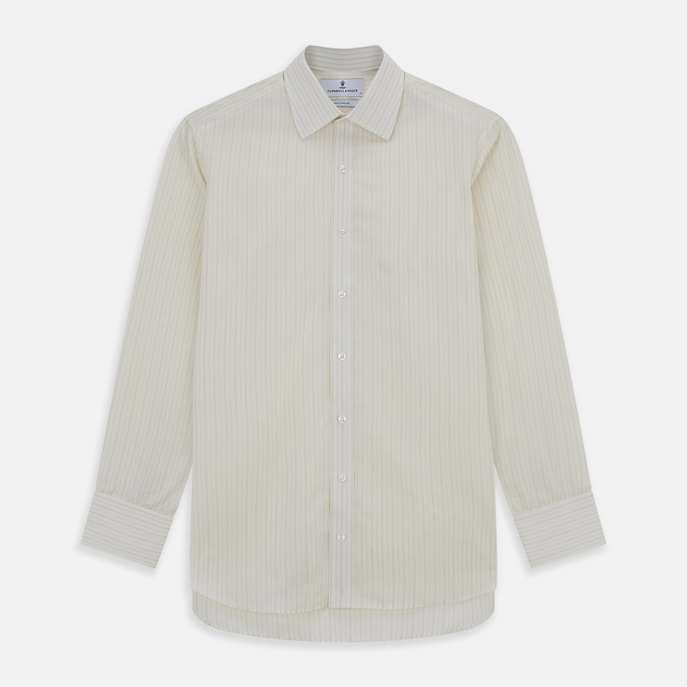 The Turnbull & Asser Pale Blue Fine Track Stripe Mayfair Shirt is a long-sleeve, cream-colored organic cotton shirt with subtle pale blue stripes, a T&A collar, and buttoned cuffs, shown on a plain white background.