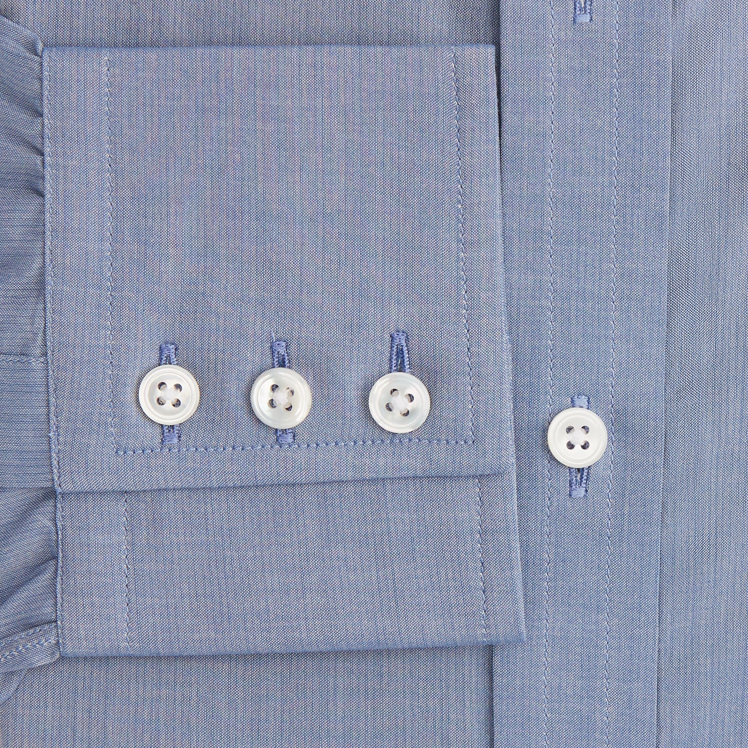 View 3 of product The Blue Mayfair Shirt by Turnbull & Asser is a long-sleeve, textured blue shirt with a classic T&A collar and white buttons, crafted from organic cotton and shown against a plain white background.