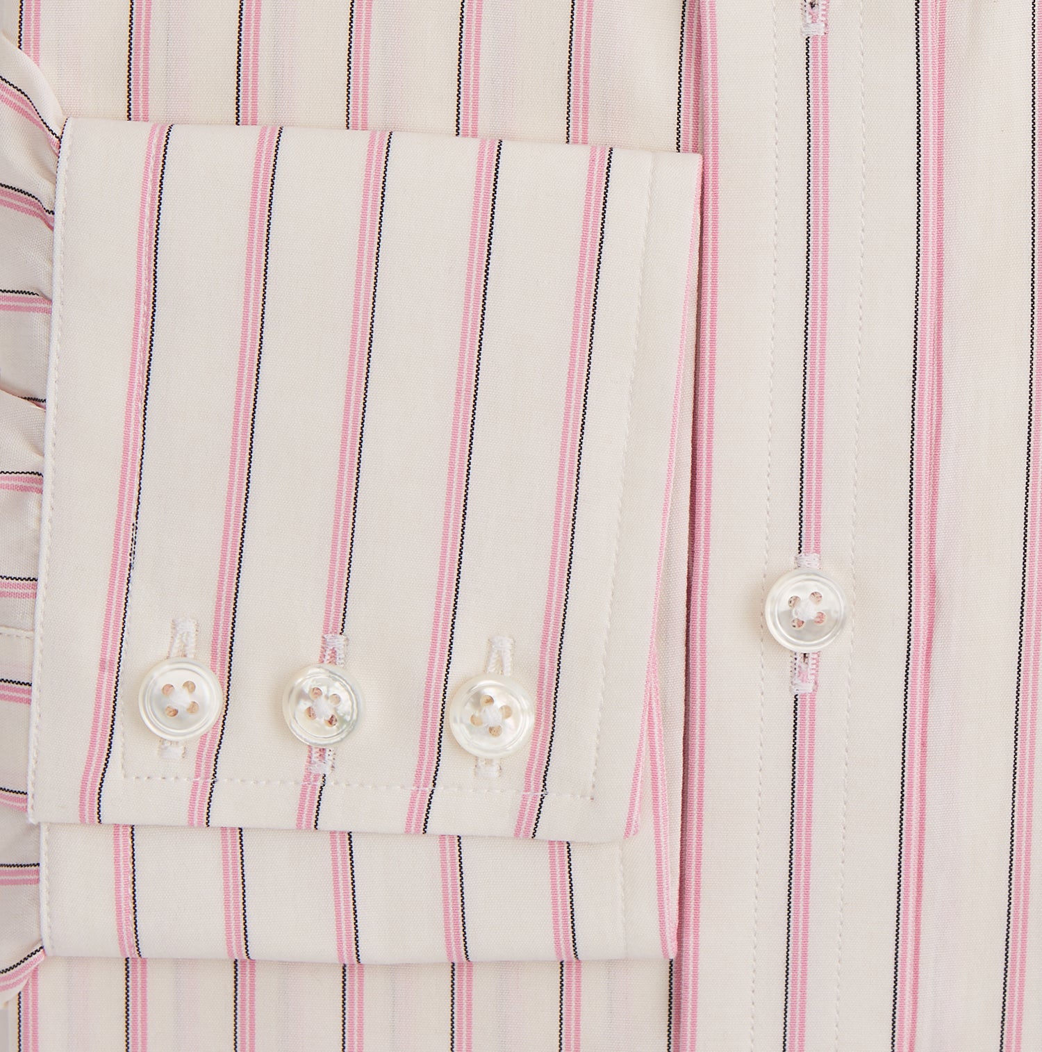 View 3 of product The Pink Fine Track Stripe Mayfair Shirt by Turnbull & Asser features a T&A collar, long sleeves, button cuffs, thin red stripes on breathable cotton, and a slightly curved hem.