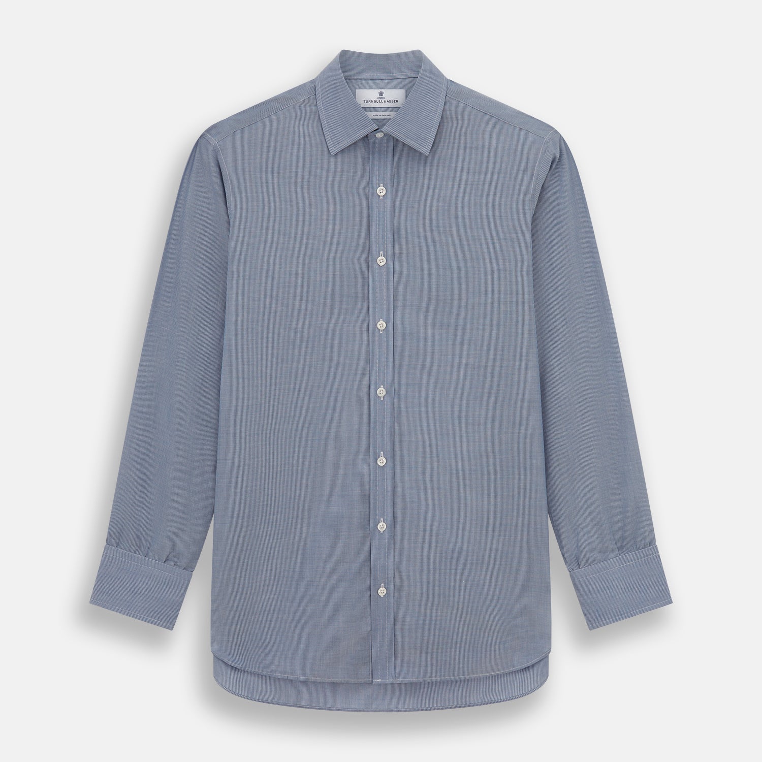 View 1 of product The Turnbull & Asser Blue Pencil Stripe Mayfair Shirt is crafted from organic cotton with a classic collar, white buttons, and buttoned cuffs. Shown laid flat on a white background.