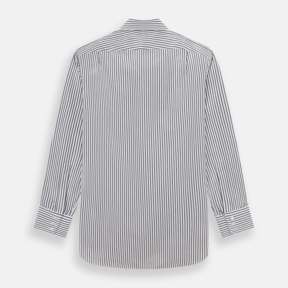 The Turnbull & Asser Midnight Blue Halo Stripe Mayfair Shirt features breathable cotton with black and white vertical stripes, a pointed T&A collar, and buttoned cuffs, displayed flat on a white background.