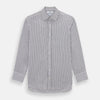 View 1 of product The Turnbull & Asser Midnight Blue Halo Stripe Mayfair Shirt features breathable cotton with black and white vertical stripes, a pointed T&A collar, and buttoned cuffs, displayed flat on a white background.