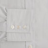 View 3 of product The Turnbull & Asser Pale Blue Fine Stripe Mayfair Shirt features a classic collar, white buttons, cuffs, a slightly curved hem, and subtle pale blue stripes for a formal tailored look. Displayed on a plain white background.