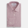 View 4 of product The Turnbull & Asser Pink Fine Graph Check Mayfair Shirt features long sleeves, breathable cotton, a pointed collar, 3-button cuffs, white buttons, and a red and white check pattern—shown on a plain white background.