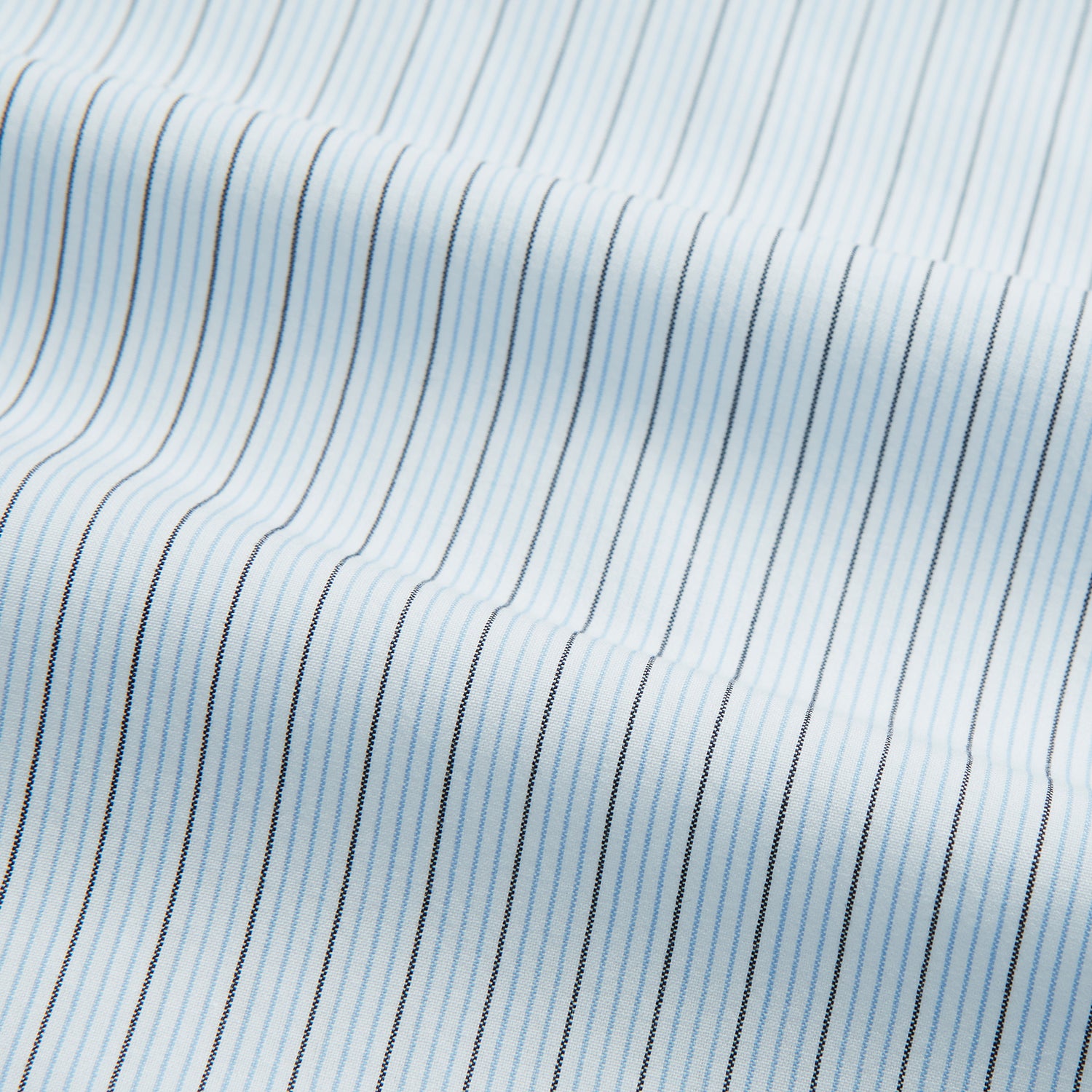 View 5 of product The Turnbull & Asser Blue Multi Pinstripe Mayfair Shirt is a long-sleeve, organic cotton dress shirt with button front, classic collar, and cuffs, shown on a white background.